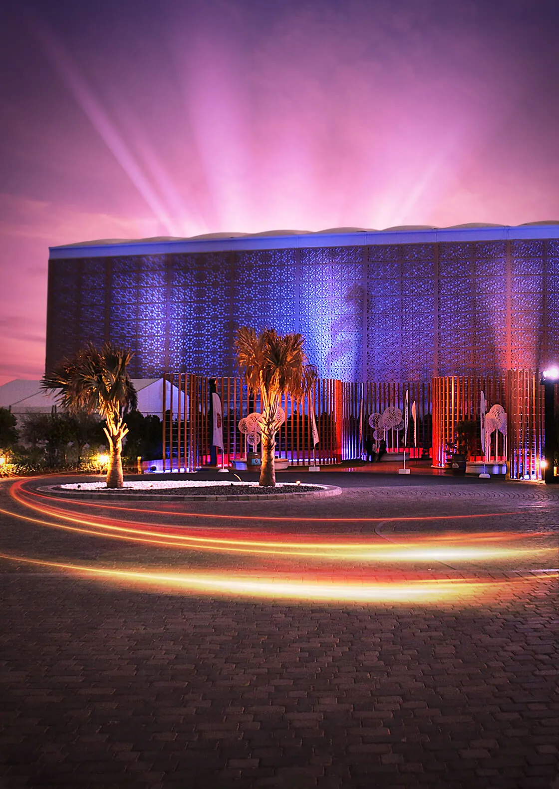 Illuminated exterior of Festival Arena in Dubai